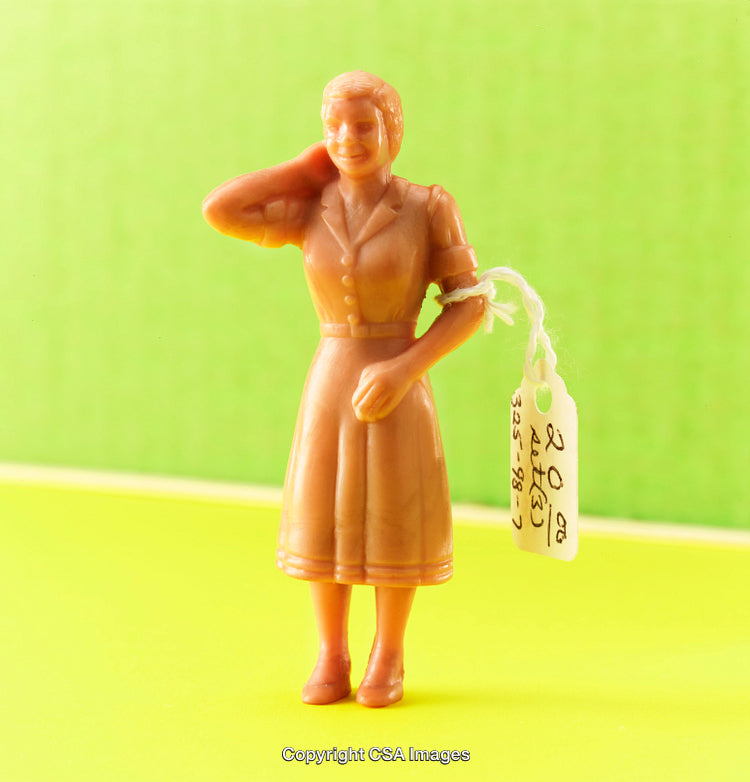 Vintage Plastic Figurine of a Woman with a Retro Style