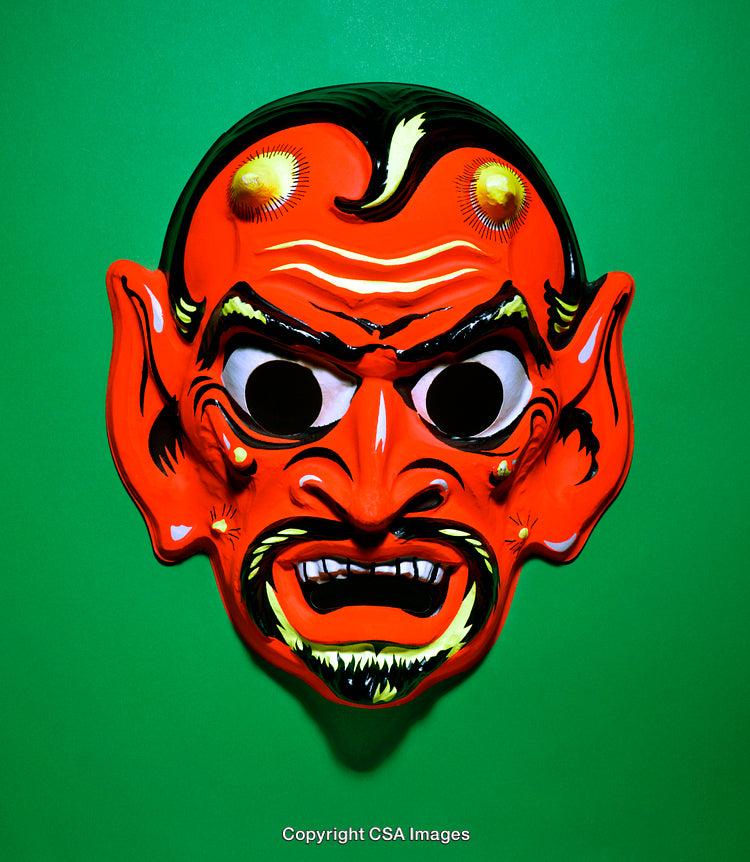 Vibrant Red Demon Mask on Bright Green Background