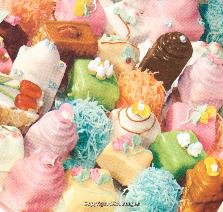 Colorful Selection of Decorative Pastries with Elegant Frosting and Garnishes