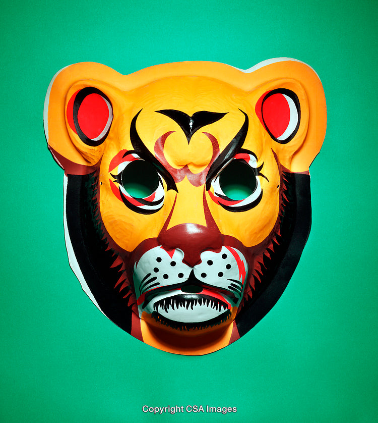 Brightly Colored Lion Mask with Artistic Detailing on Green Background