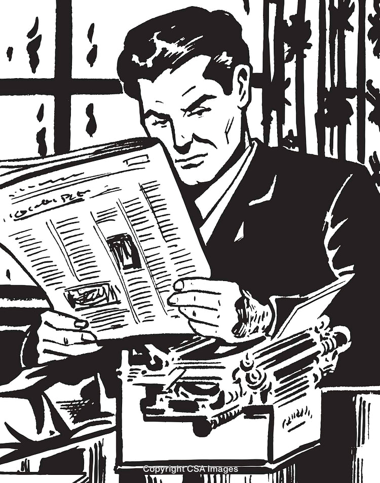Man Reading Newspaper While Sitting at Desk with Vintage Typewriter