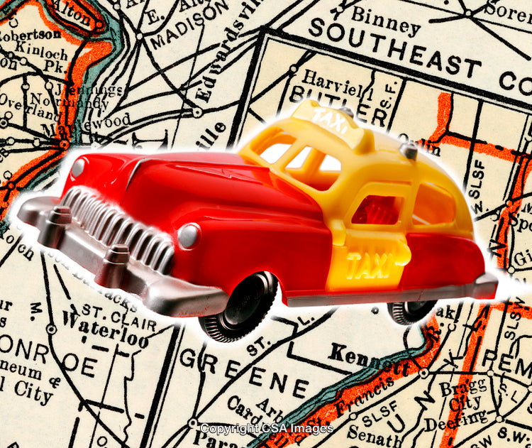 Colorful Toy Taxi Model Over Vintage Map Background