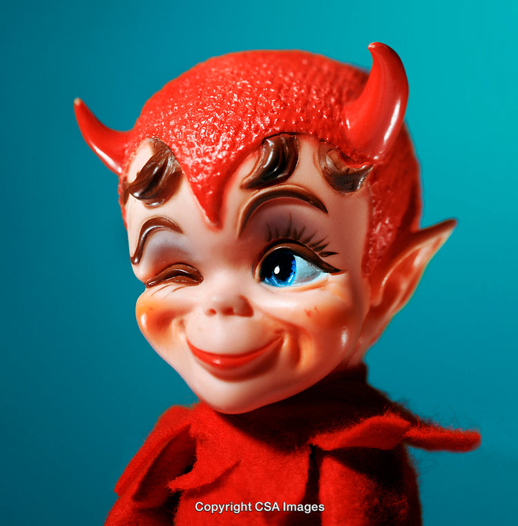 Whimsical Red Devil Doll Smiling Playfully with Bright Blue Background