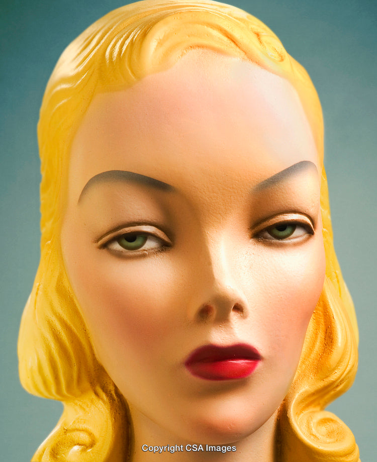 Close-Up Portrait of a Retro Blonde Figurine with Red Lips