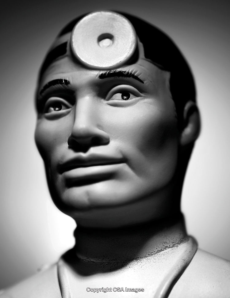 Close-Up of Doctor Figurine in Black and White Light