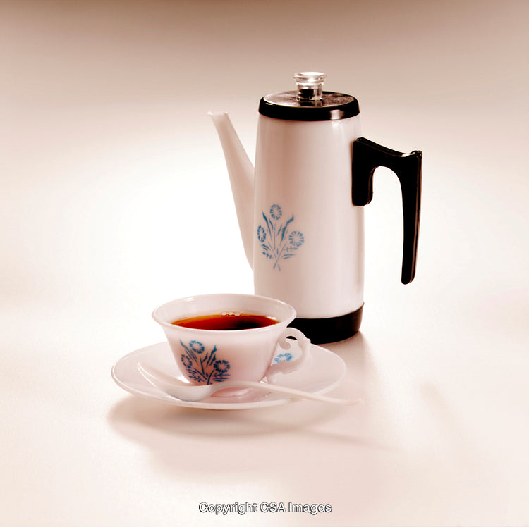 Vintage Style Ceramic Tea Set with Floral Design in a Minimalist Setting