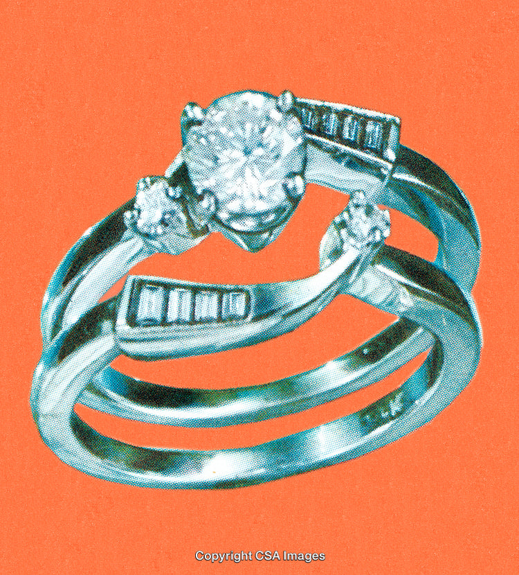 Elegant Diamond Ring Set Against a Minimalist Bright Orange Background
