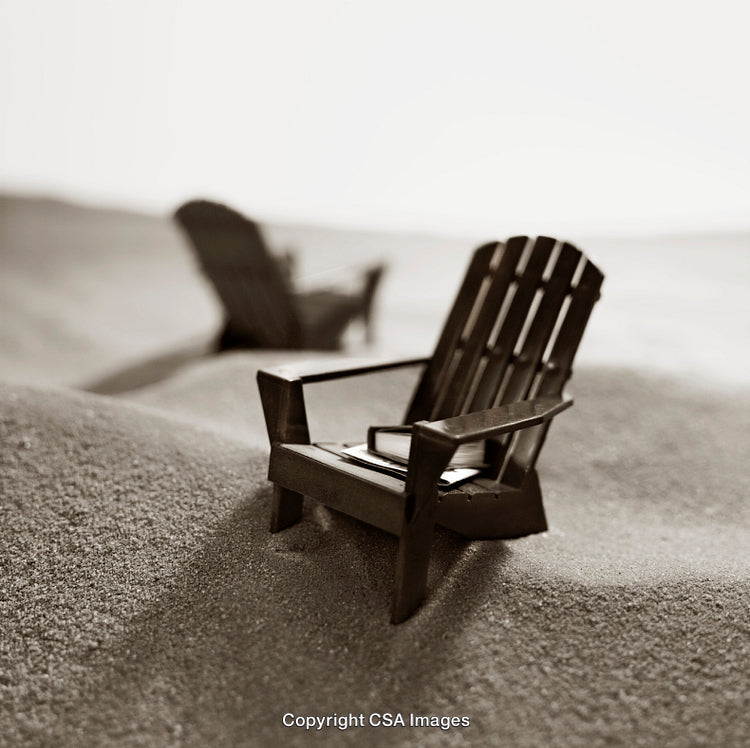 Miniature Adirondack Chairs on Sand in Monochrome Artistic Setting
