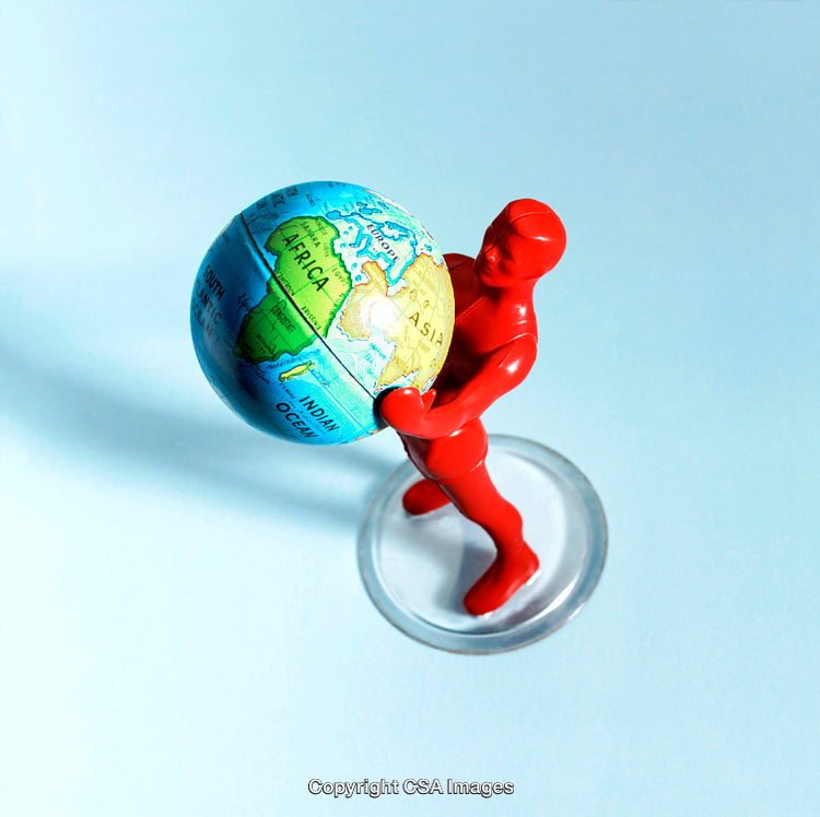 Red Toy Figure Holding a Small Globe on a Blue Background