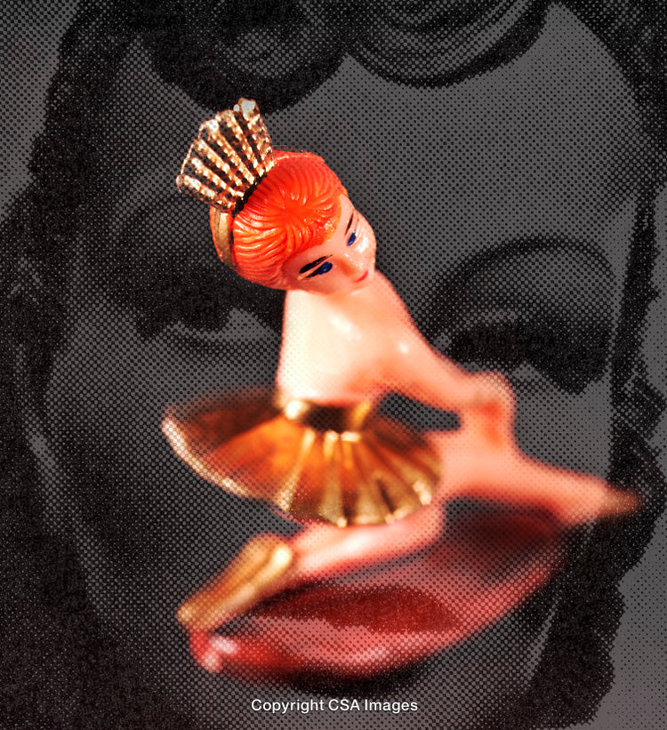 Close-Up of Retro Plastic Ballerina Figurine on Artistic Background