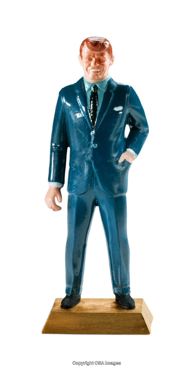 Plastic Figurine of a Suit-Clad Man Standing on a Wooden Base