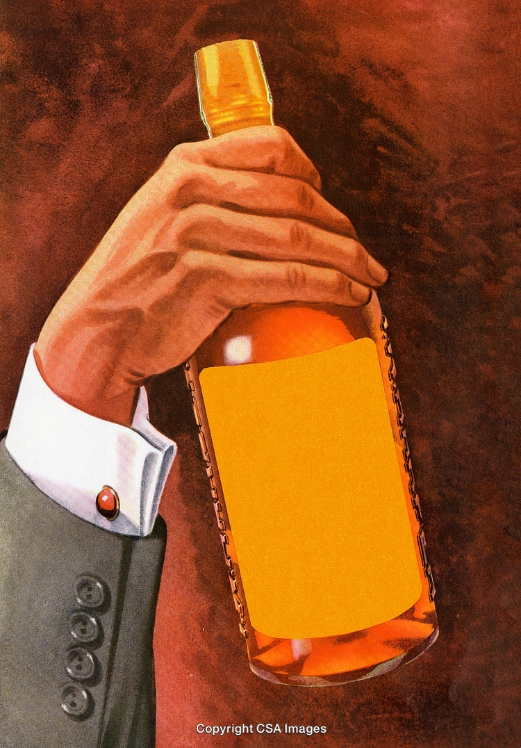 Hand Holding Amber Glass Bottle With Blank Label Against Dark Background