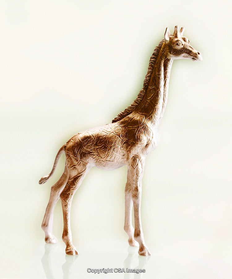 Close-Up of a Plastic Giraffe Figurine in Bright Lighting