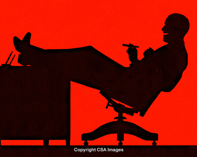 Silhouette of a Relaxed Businessman With Feet Up on Desk in Red Light