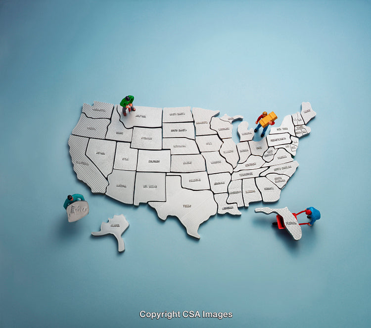 Map of the United States With Miniature Toy Figures Exploring States