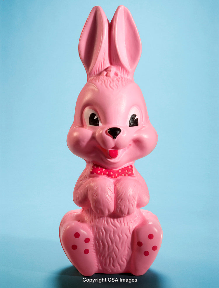 Pink Rabbit Toy on Vibrant Blue Background in Studio Lighting