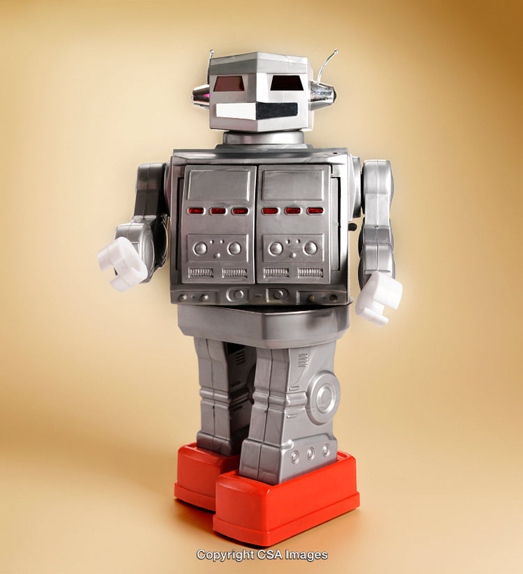 Vintage Robot Toy With Silver Body and Red Feet on Yellow Background