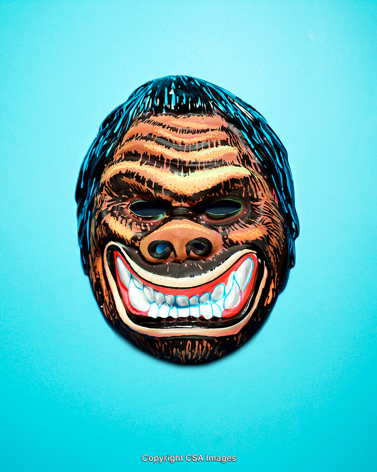 Close-Up of a Vibrant Gorilla Mask on Blue Background