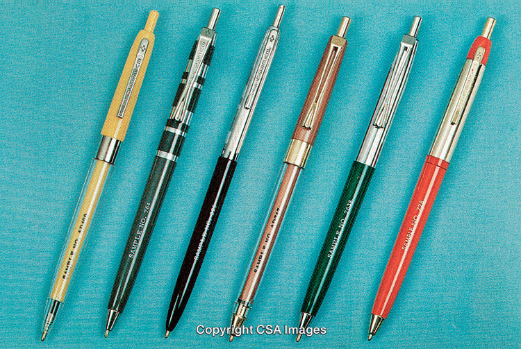 Array of Colorful Retractable Ballpoint Pens Arranged in a Row on Blue Background