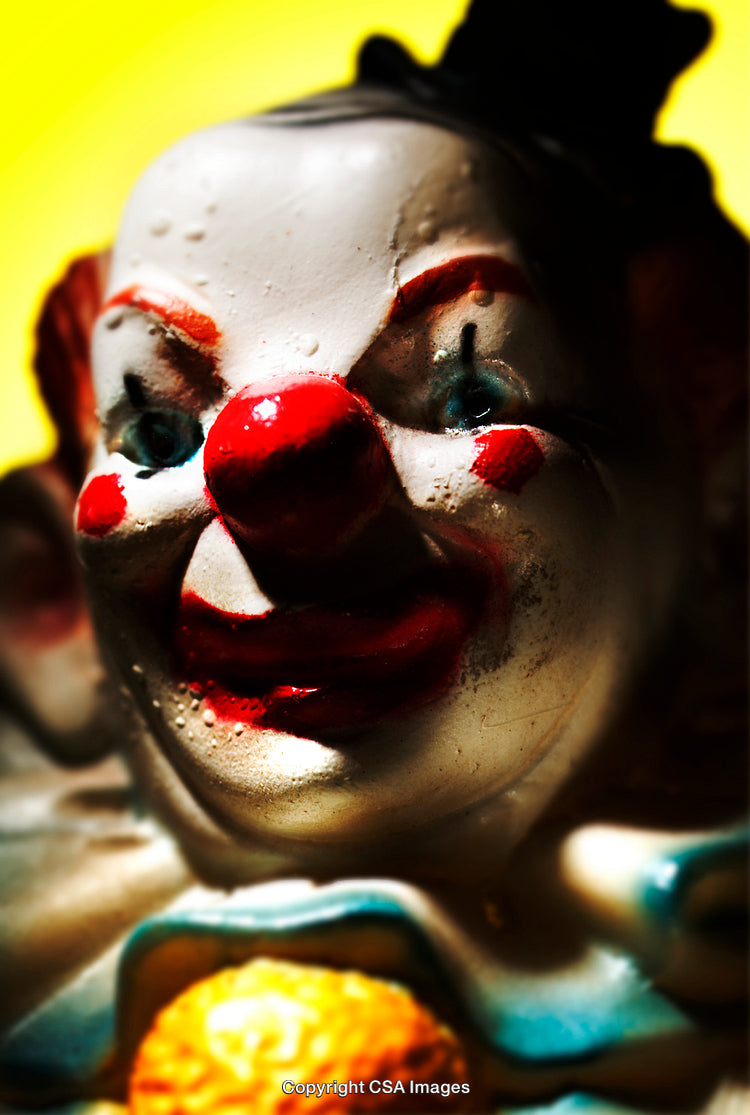 Closeup of a Colorful Plastic Clown Figure With Dramatic Lighting