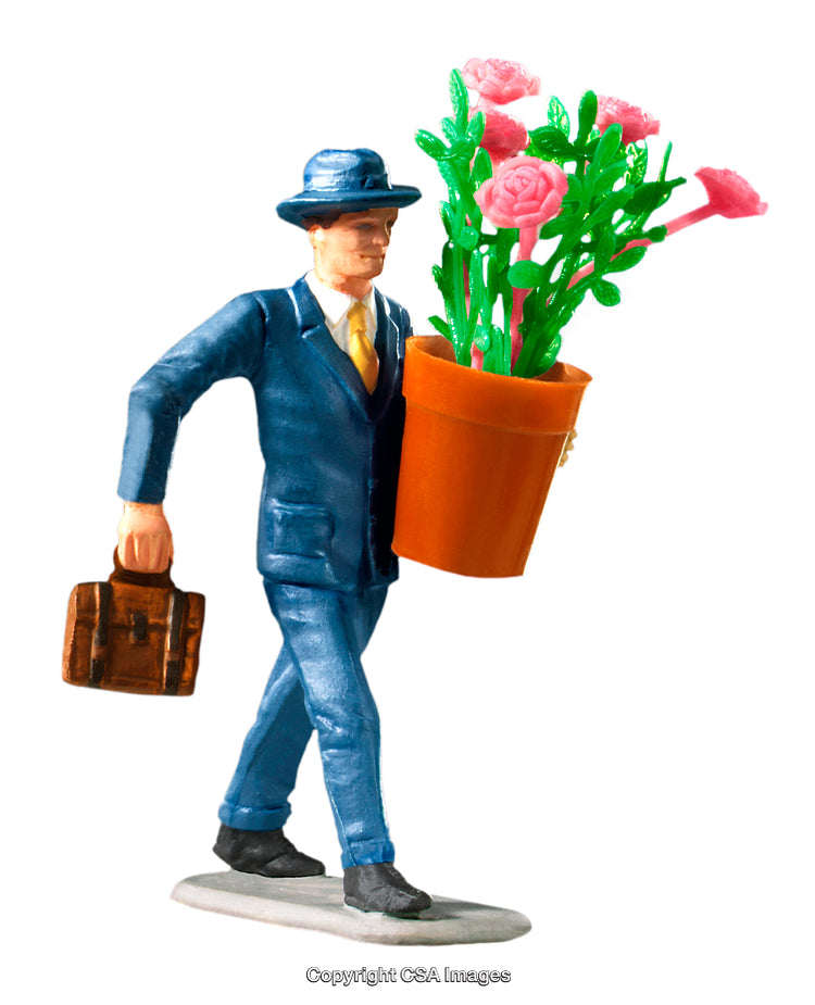 Close-Up of Toy Figurine Carrying Potted Flowers and a Briefcase