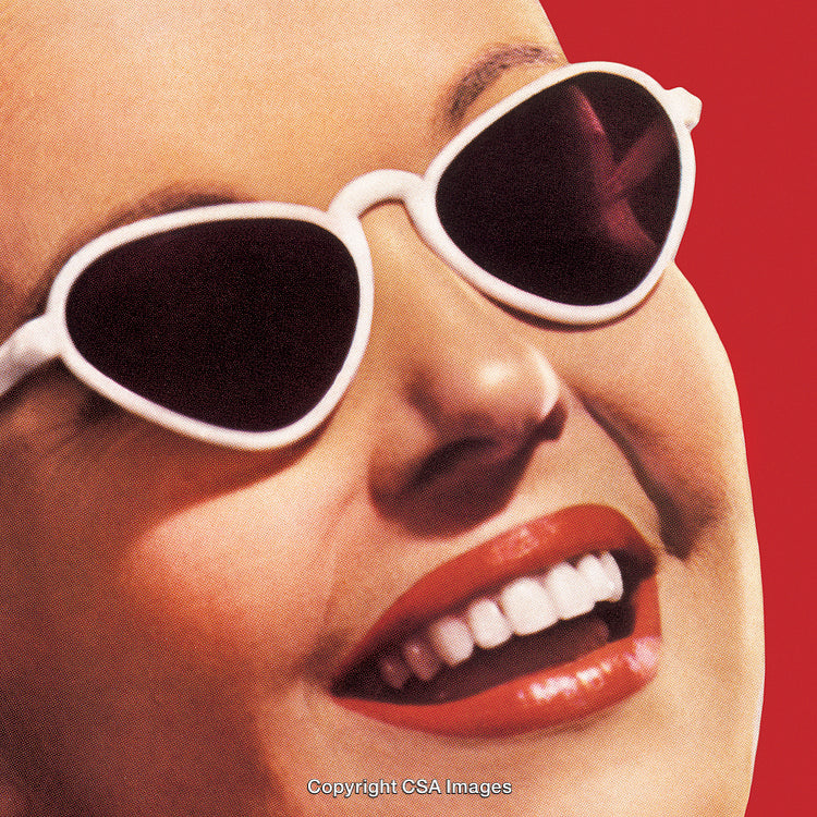 Close-Up of Smiling Woman Wearing Sunglasses with Retro Aesthetic