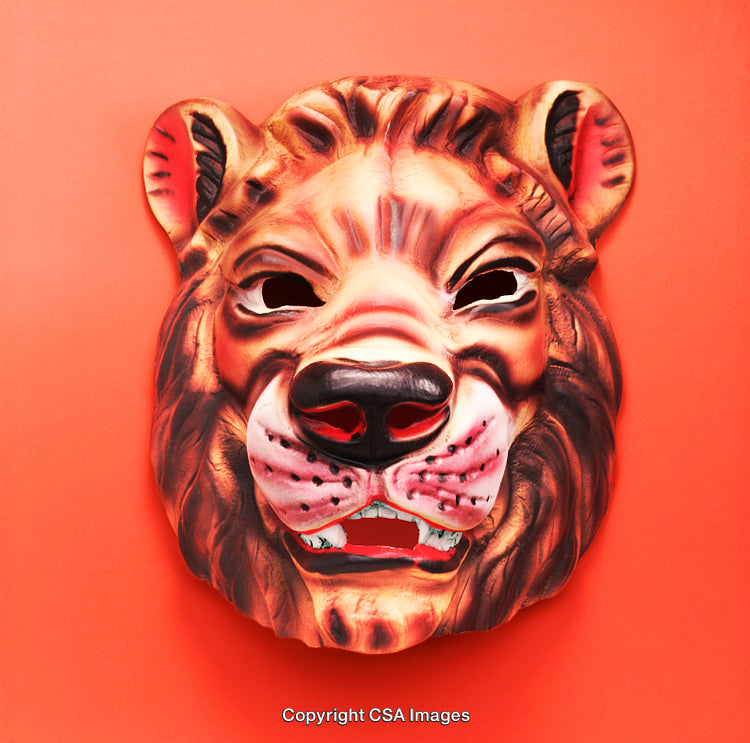 Close-Up of a Lion Mask on a Bright Orange Background