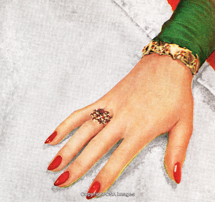 Elegant Hand with Red Nails Wearing Jewelry and Green Attire