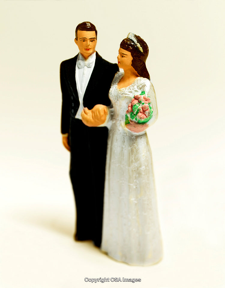 Bride and Groom Figurines Depicting a Classic Wedding Scene