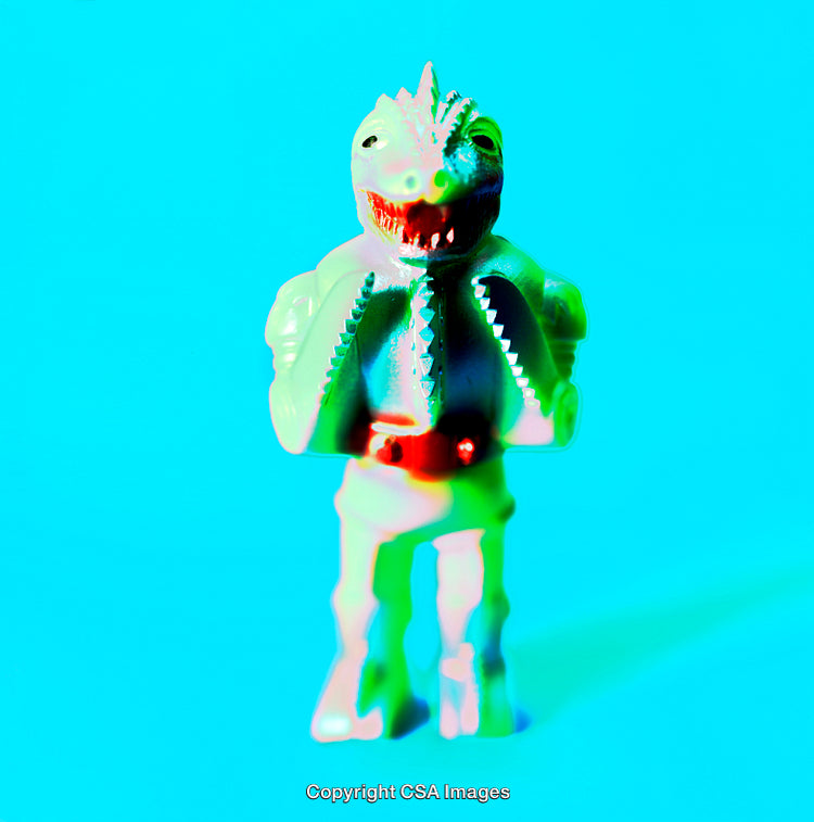 Colorful Plastic Toy Dinosaur Figurine on a Vibrant Blue Background