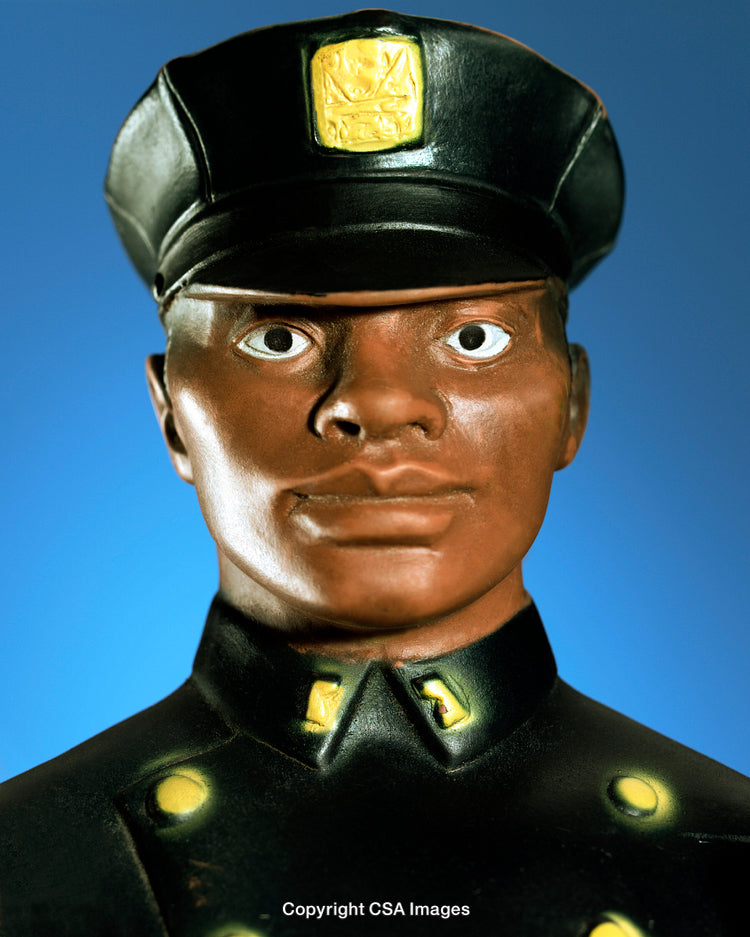 Close-Up of a Toy Soldier Figure Against a Blue Background