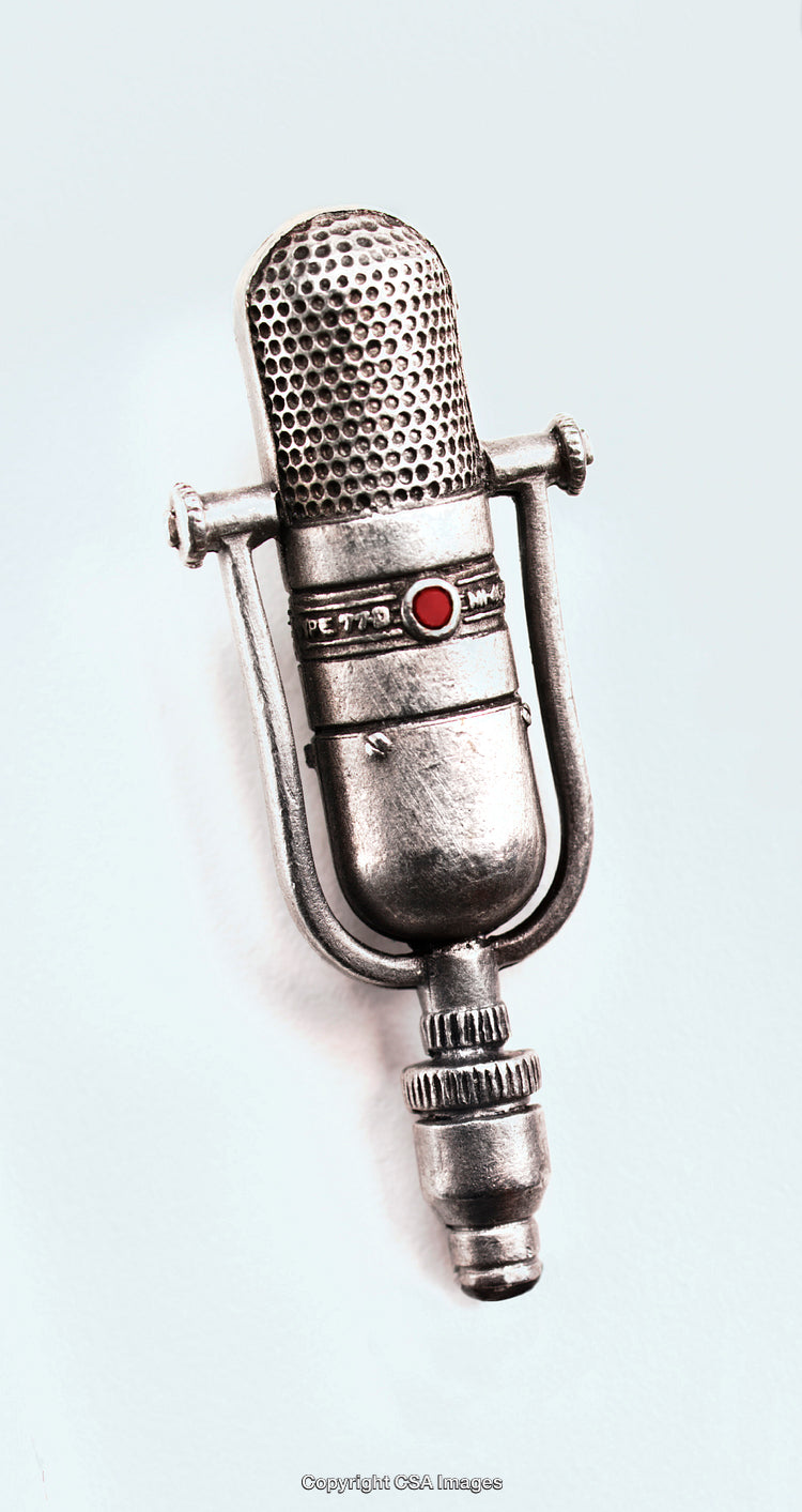 Retro Styled Metal Microphone Toy With Intricate Detailing on White Background