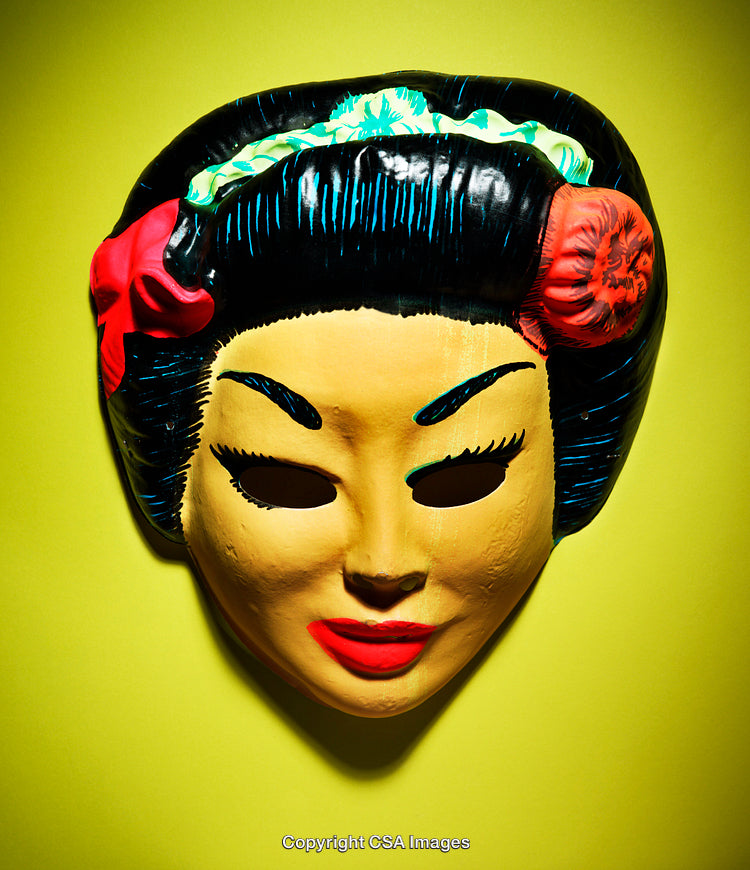 Vintage Plastic Mask in Bright Lighting Against Yellow Background