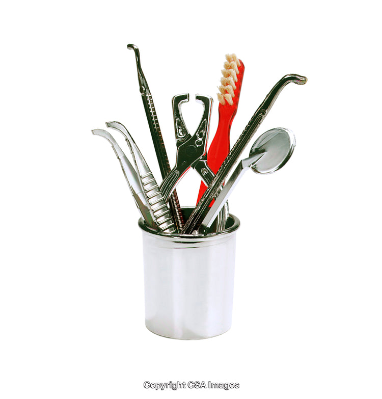 Collection of Dental Tools in a Stainless Steel Holder Isolated on White