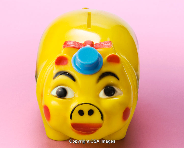 Yellow Piggy Bank with Facial Details on Pink Background
