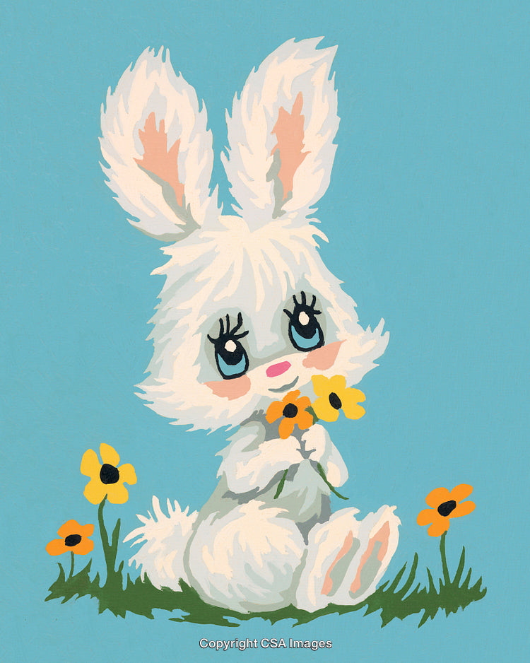 Adorable Bunny With Flower Bouquet Sitting in a Meadow on Sunny Day