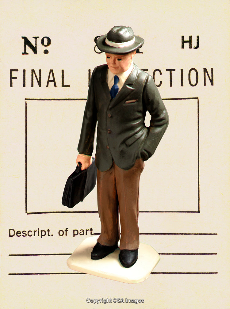 Vintage Figurine of Businessman with Briefcase on Inspection Form Background