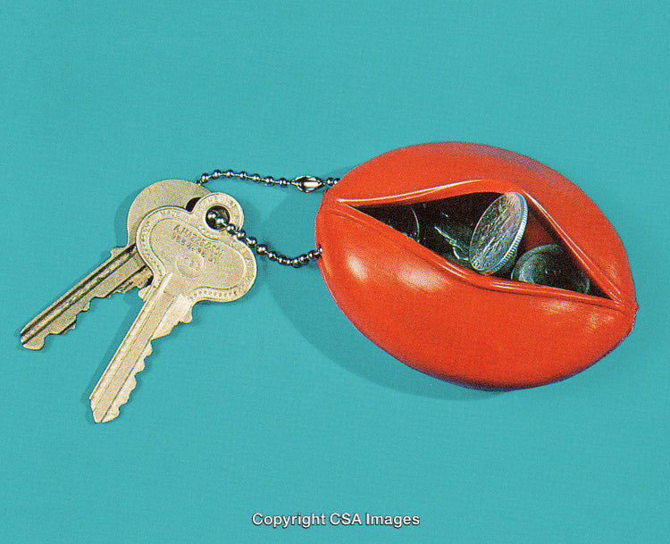 Red Coin Holder and Keys Against a Solid Blue Background
