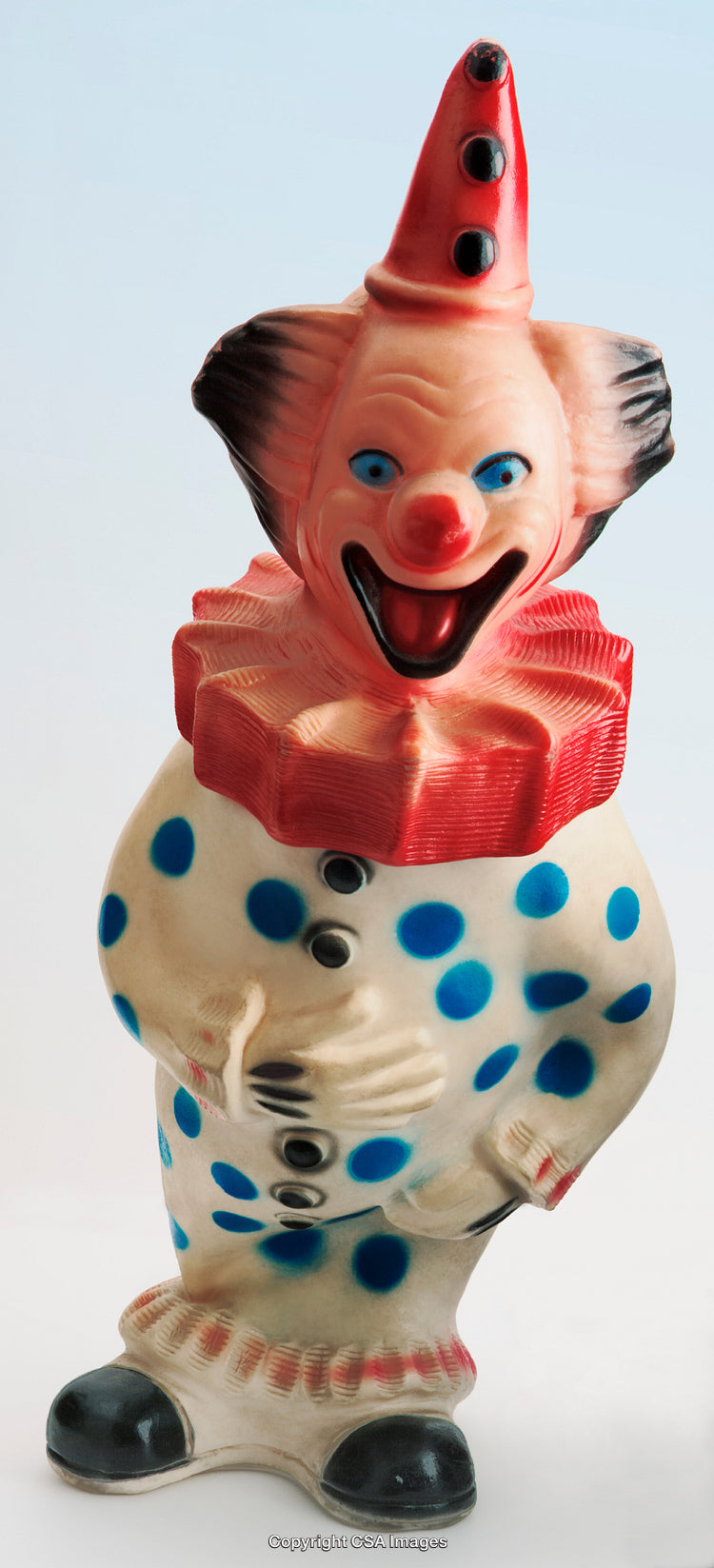 Vintage Polka-Dot Clown Figurine with Cheerful Expression and Red Hat