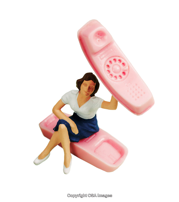 Surreal Composition of Miniature Woman with Oversized Pink Retro Telephone