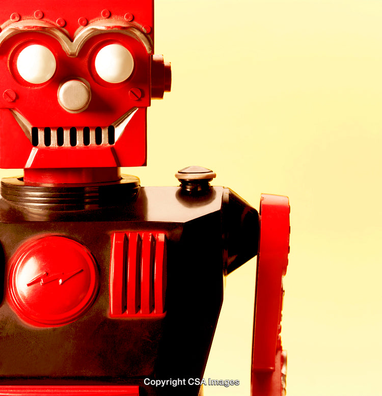 Red Retro Robot Toy Isolated Against a Vibrant Yellow Background