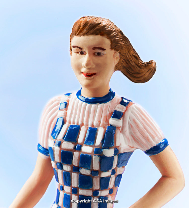 Plastic Toy Figurine with Detailed Features on Blue Background