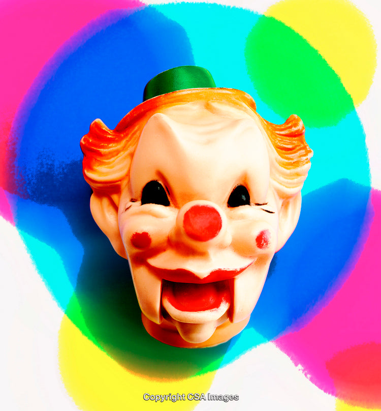 Colorful Background Featuring Vintage Clown Toy Face Sculpture