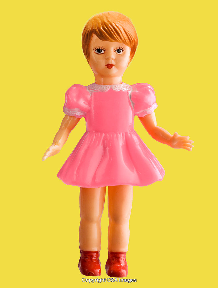Vintage Plastic Doll in Pink Dress on Yellow Background