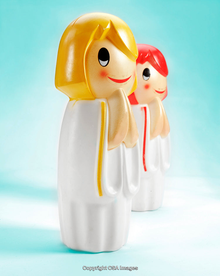 Colorful Plastic Figurines of Cartoon Characters on a Bright Background