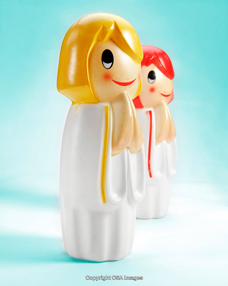 Colorful Plastic Figurines of Cartoon Characters on a Bright Background