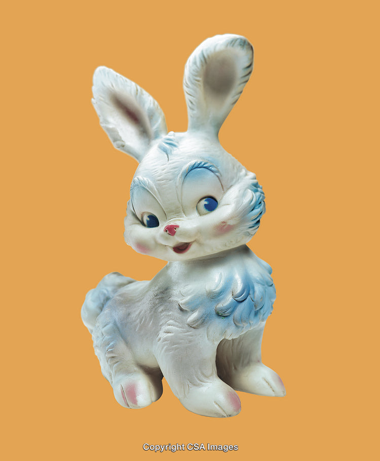 Cute Vintage Bunny Figurine on a Bright Orange Background