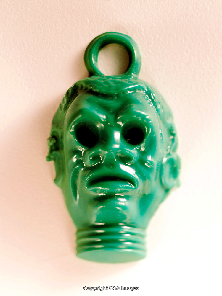 Close-Up of Green Plastic Toy in Abstract Shape